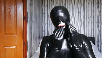 Gag And Blindfolded Latex Slave In Bondage And Domination