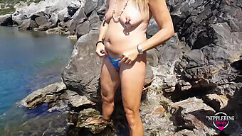 Milf With Extreme Piercings Nipples And Pussy Swims Naked At Public Beach